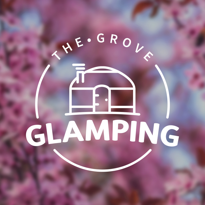 Logo of The Grove Glamping over a blurred background